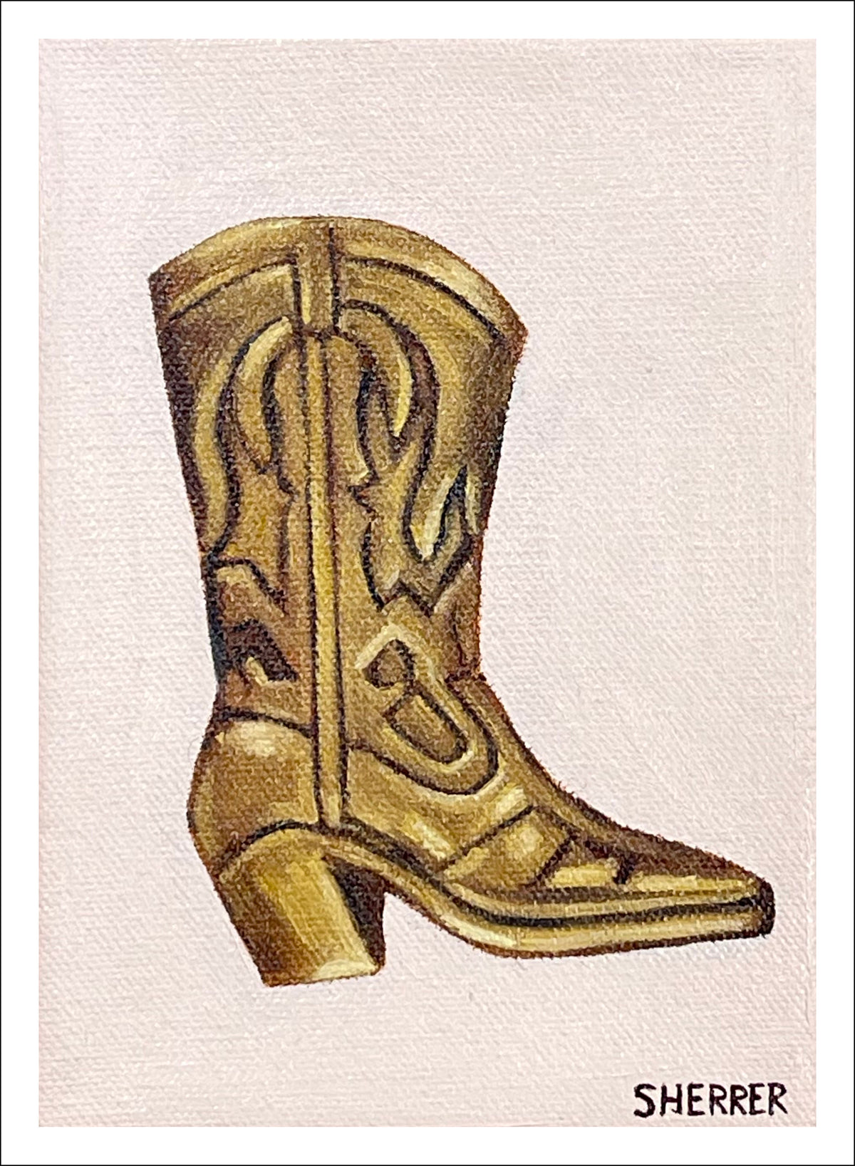 Brass Boot fine art print by Caroline Sherrer, featuring a small brass cowboy boot resting on a light tan background.