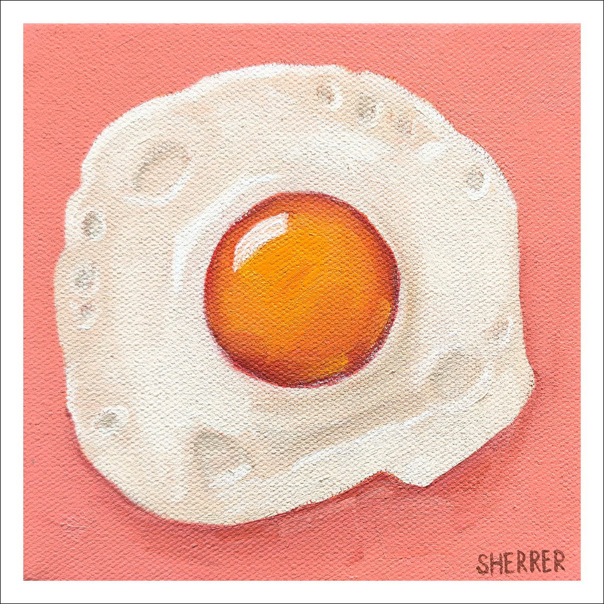 Egg-cellent fine art print by Caroline Sherrer, featuring a sunny-side-up fried egg on a brick red background.
