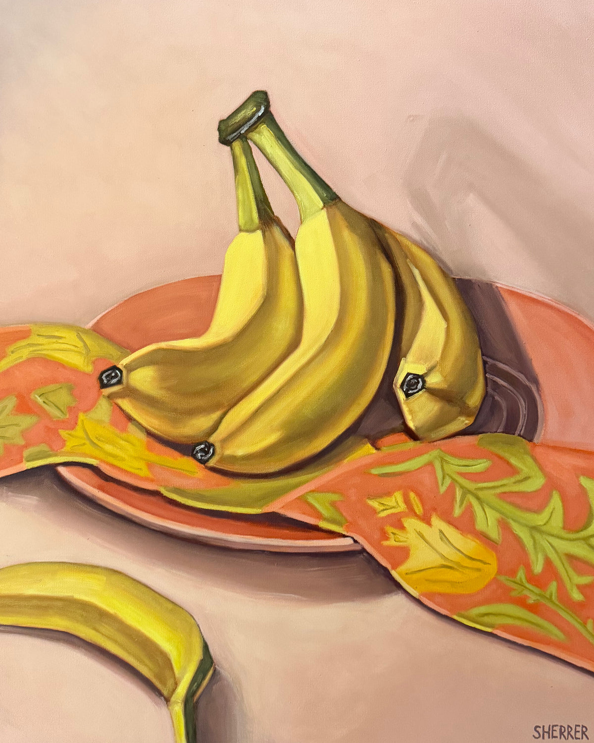 Bananas and Botanicals II, original oil painting by Caroline Sherrer, featuring painted bananas resting on a pink plate that is draped with a pink, green and yellow napkin. The bananas and plate sit on a mauve background.