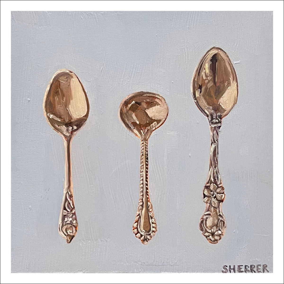 Muted Purple Spoons fine art print by Caroline Sherrer, featuring vintage metal spoons in a row resting on on a plain muted purple-gray background.