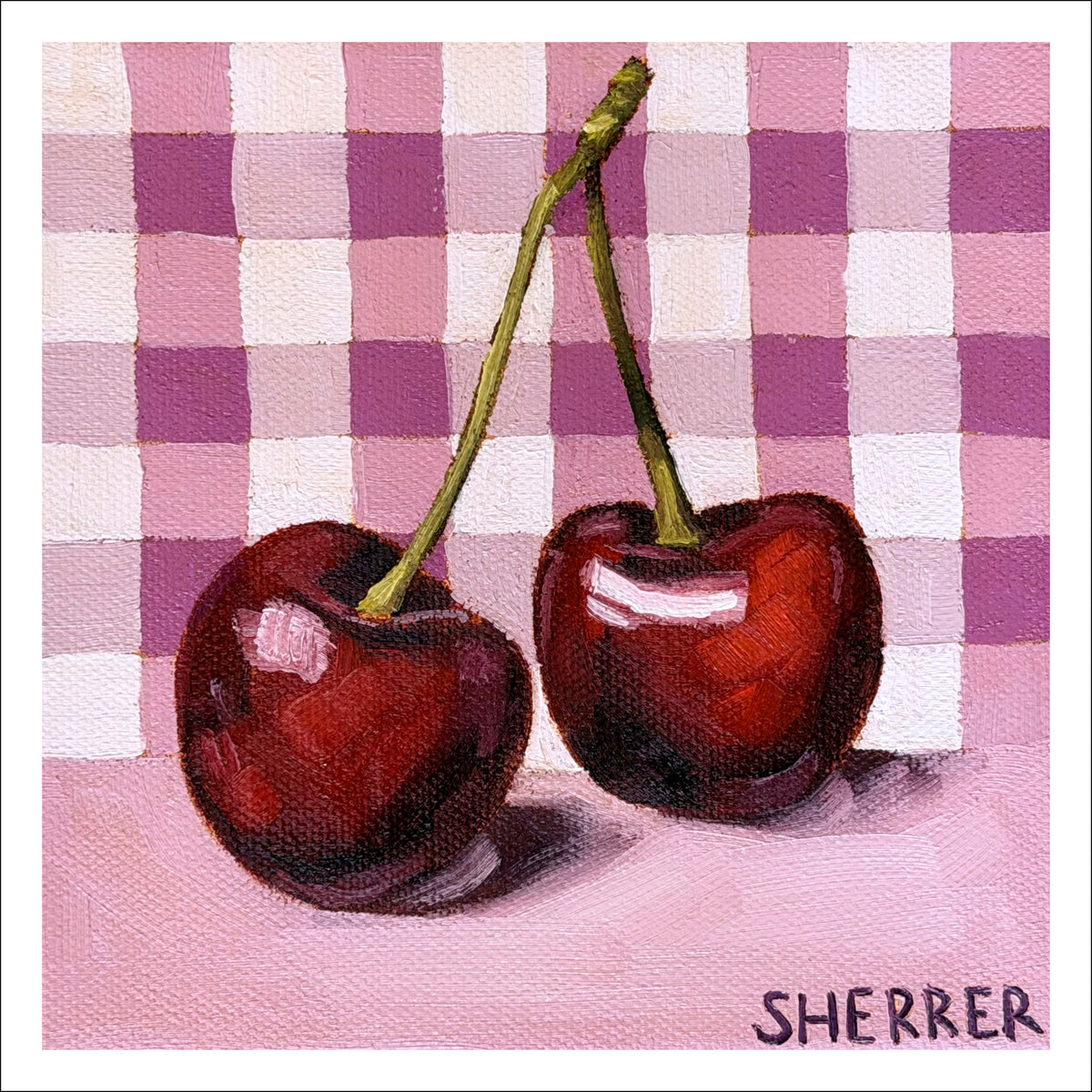 Cherries on Gingham fine art print by Caroline Sherrer, featuring two cherries resting on a pink and purple gingham background.