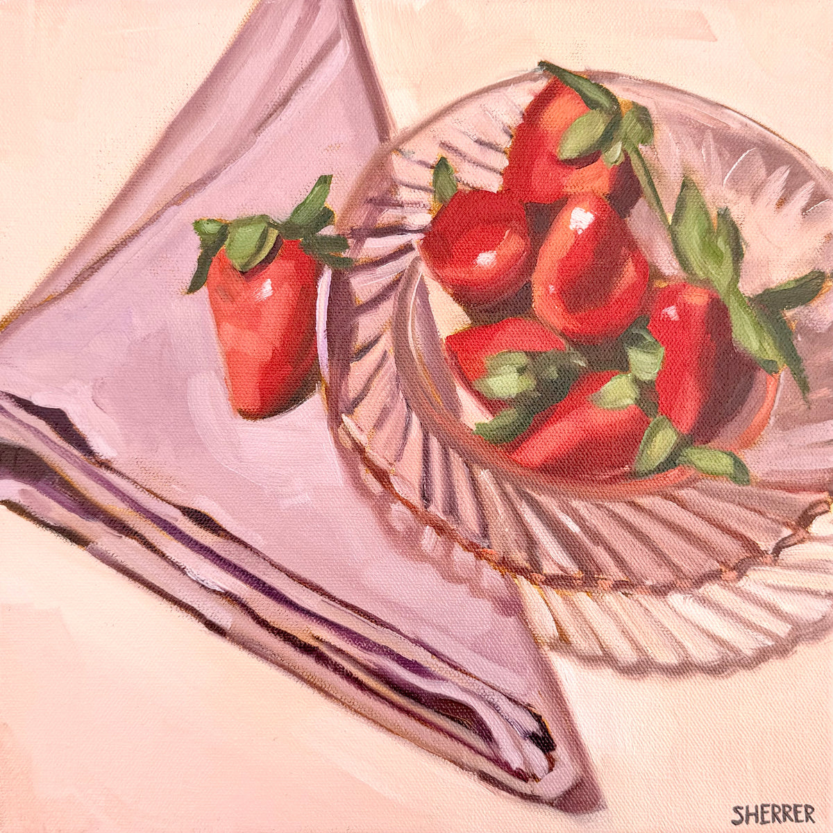 Summer Table, original oil painting by Caroline Sherrer, featuring strawberries on a clear pink glass plate. The plate is on a folded purple napkin. There is one stray strawberry on the napkin. The background is light pink.
