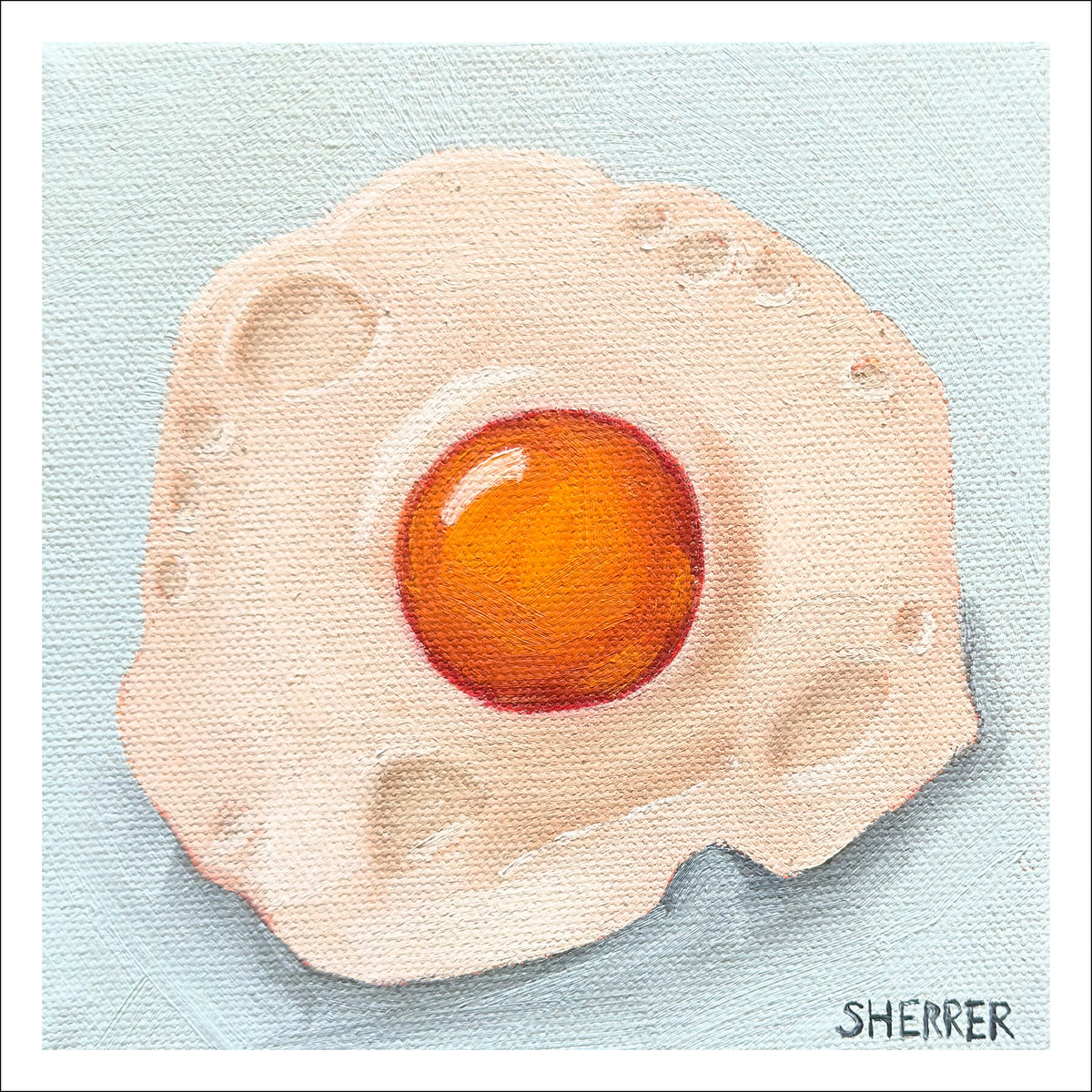 Sunny Side II fine art print by Caroline Sherrer, featuring a sunny-side-up fried egg on a light blue background.