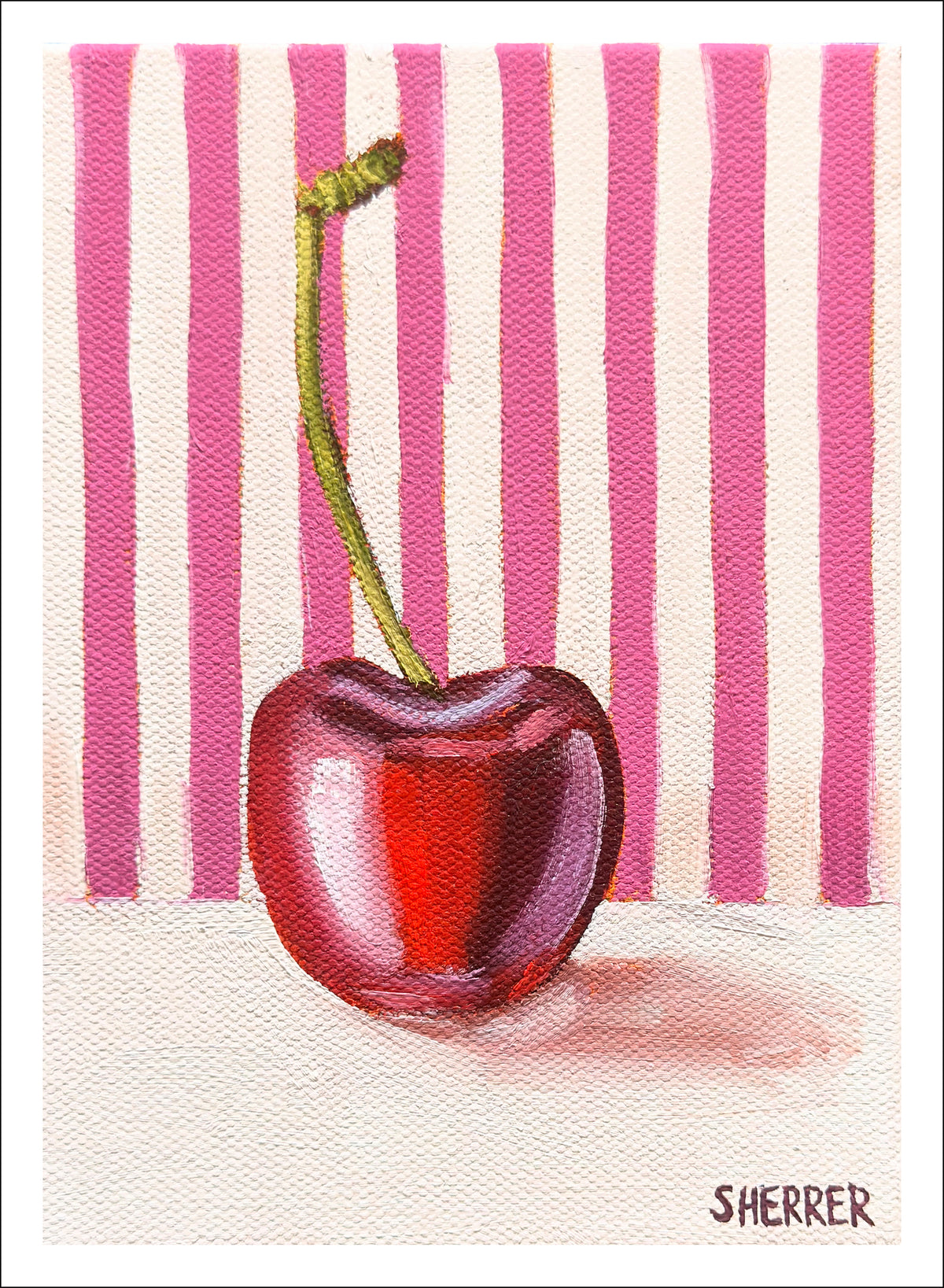 Pink Repeat fine art print by Caroline Sherrer, featuring a single red cherry resting on a pink-and-white stripe background.
