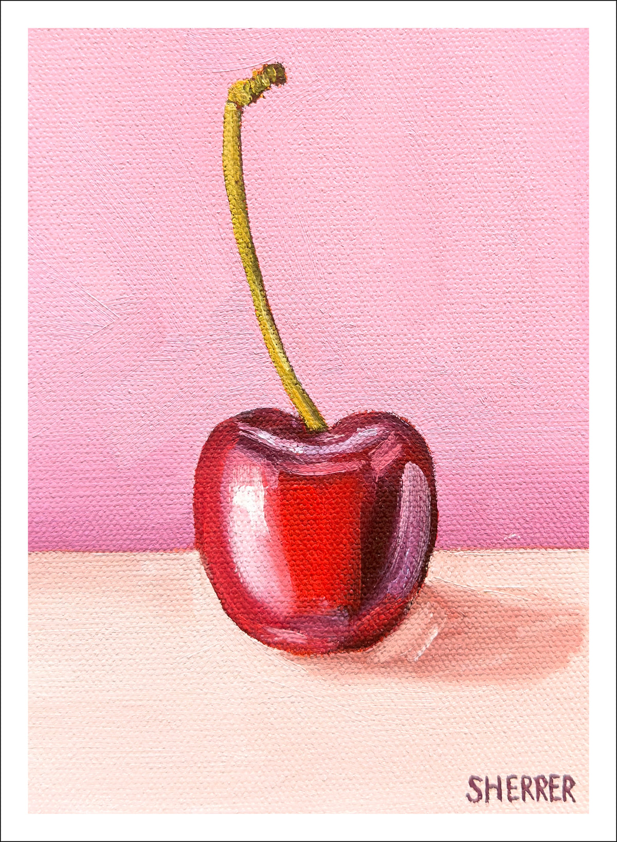 Cherry Blush fine art print by Caroline Sherrer, featuring a single red cherry resting on a berry-pink background.
