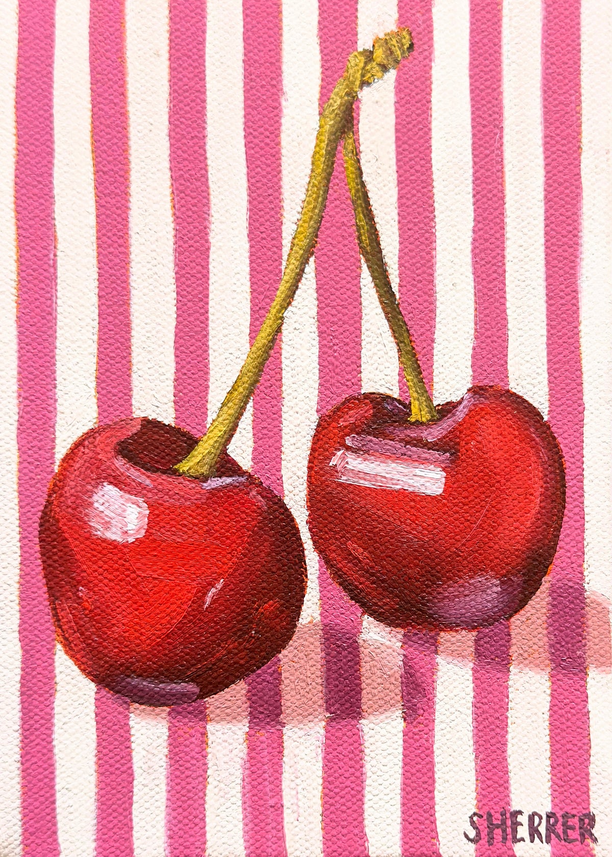 Side by Side, original oil painting by Caroline Sherrer, featuring two cherries resting on a pink and white striped background.