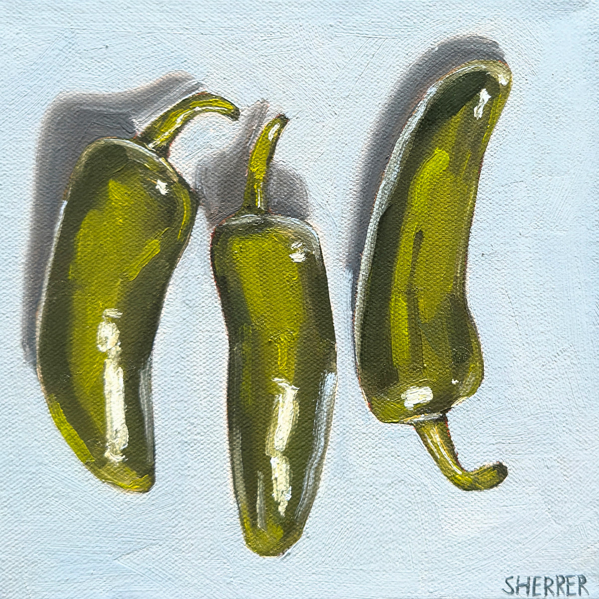 Three Amigos, original oil painting by Caroline Sherrer, featuring three green jalapeno peppers on a light blue background.